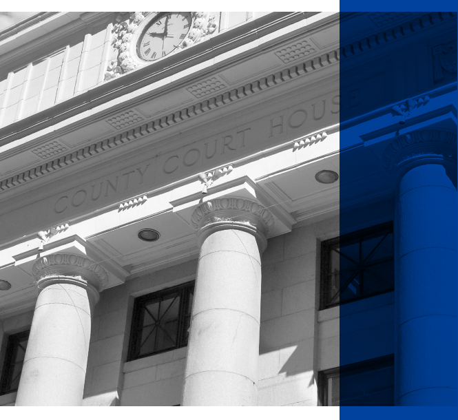 A black and white image of a courthouse.