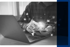 BW AI Laptop Image_Dark Blue (1) A man sitting at a laptop with AI icons floating